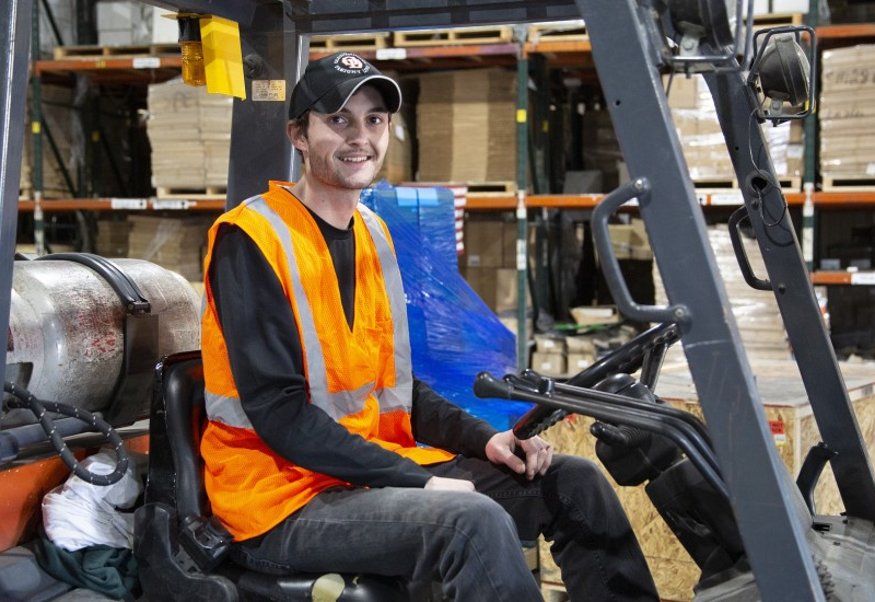 Young driver after getting his forklift certification card